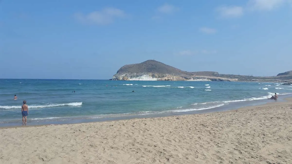 winter breaks for nature lovers in spain, people swimming in cabo de gata beach