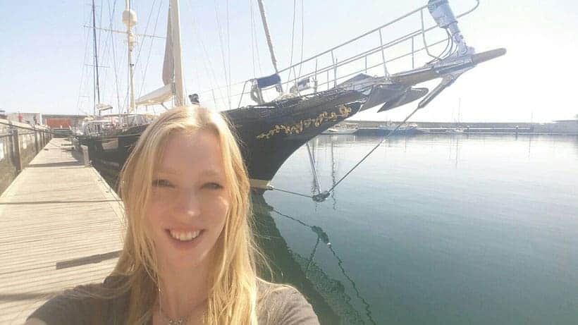 happy girl in front of a sailing ship, selfie, sailing blog, adventure