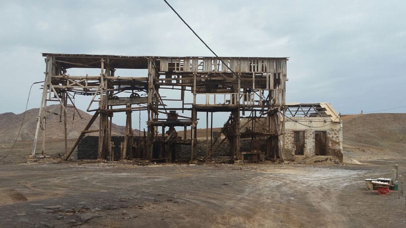 a ruined from fire building on dry land