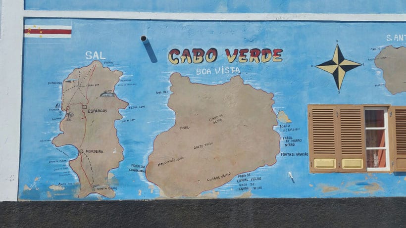 Take part in the best things to do on sal cape verde, painted wall featuring a map of Cabo Verde next to the wooden shutters of a window