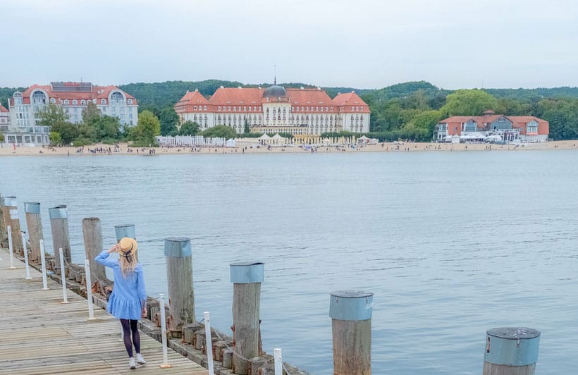 a woman walking along sopot pier