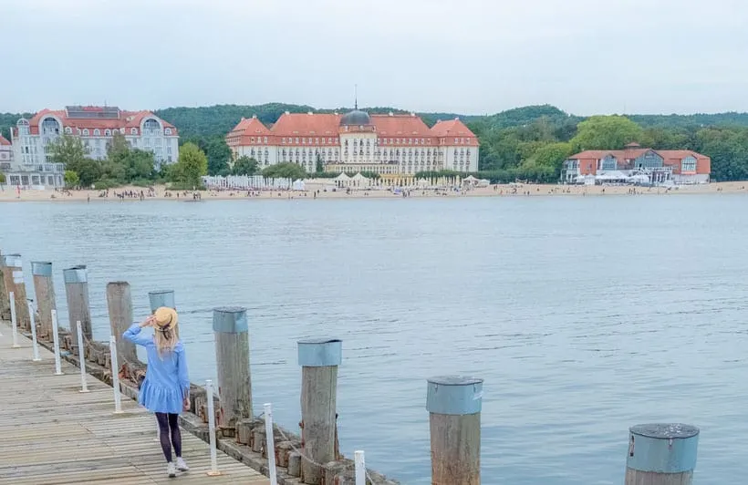 a woman walking along sopot pier