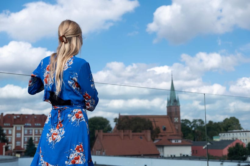 a woman overlooking on the city of koscierzyna