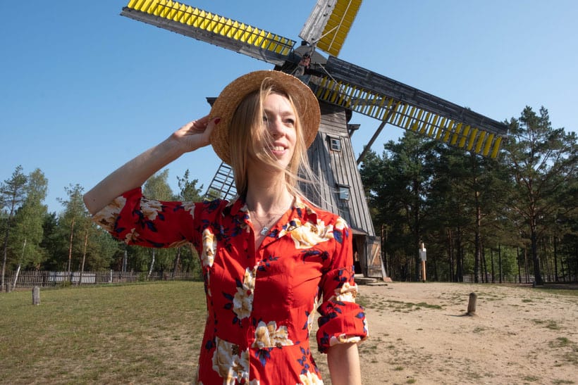 things to do on your gdansk trip, posing in front of the windmill at the Wdzydze Ethnographic Museum