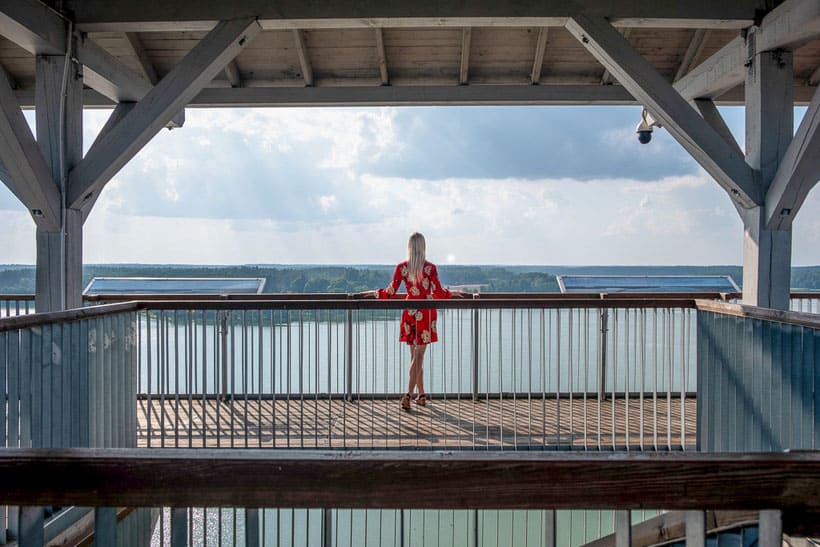 view from the Wdzydze Watch Tower with a woman posing