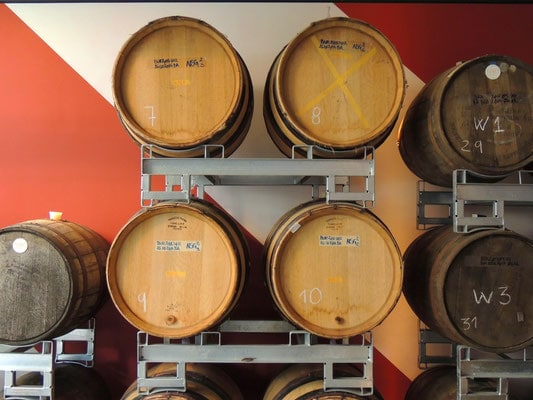 where to get the best traditional beer in brussels, numbered barrels of beer against a wall