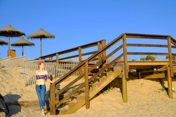 where to get winter sun in algarve, posing at the pier on quinta do lago beach