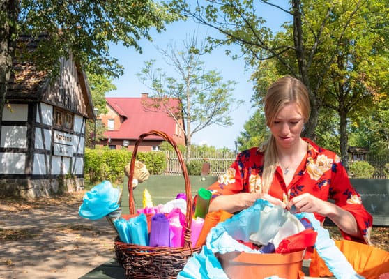 Wdzydze Ethnographic Museum, a woman playing with arts and crafts