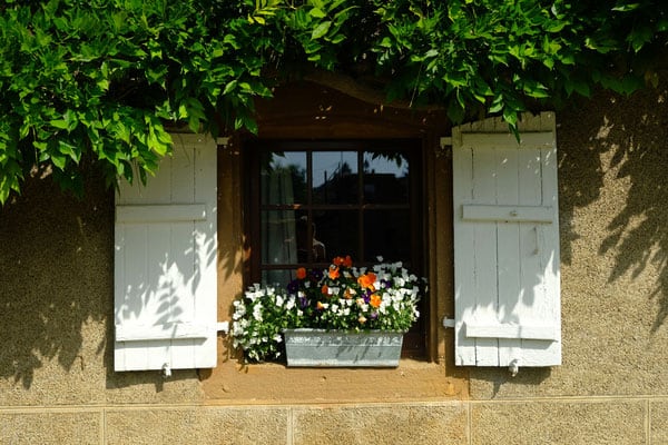 weekend trips to belgium, window with white shutters in ardennes
