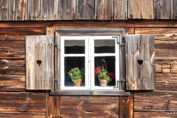 a cute window with plants at one of the traditional homes at Wdzydze Ethnographic Museum