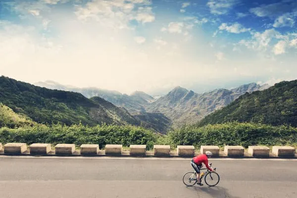 things to do in tenerife outside, person cycling through the mountains