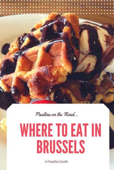 Pin with image of waffle covered in chocolate sauce with fruit with the text "Where to eat in Brussels"