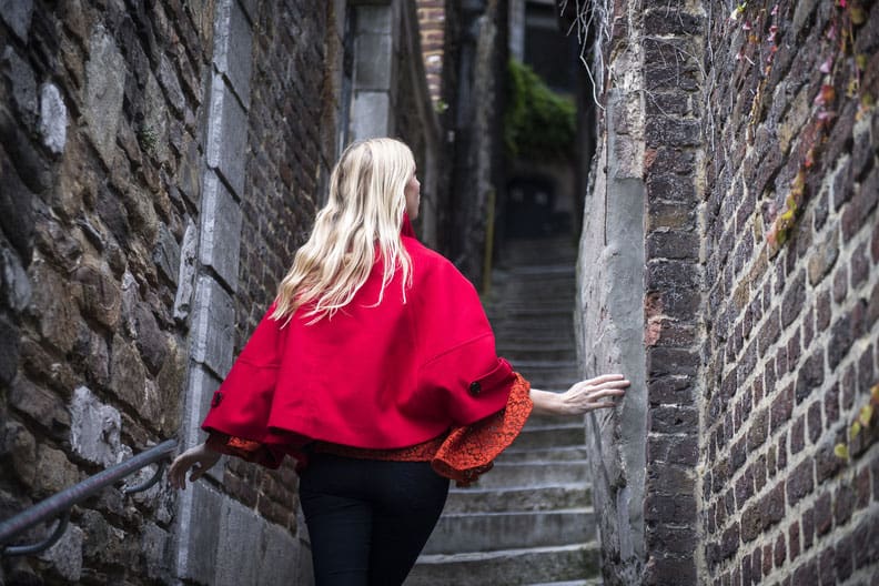 places to visit in liege belgium, a woman heading up to the liege cathedral