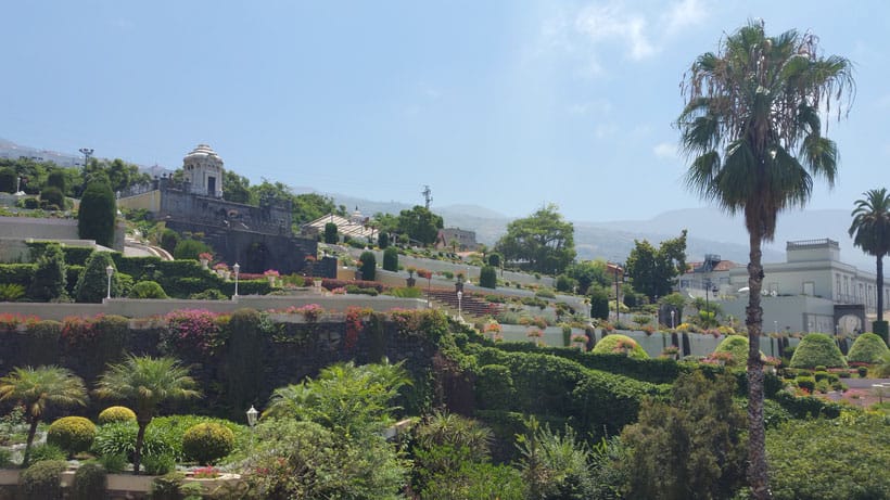 Why moving to Tenerife could be the best thing you can do, view of colourful and ornate garden with trees and trimmed hedges arranged in neat tiers