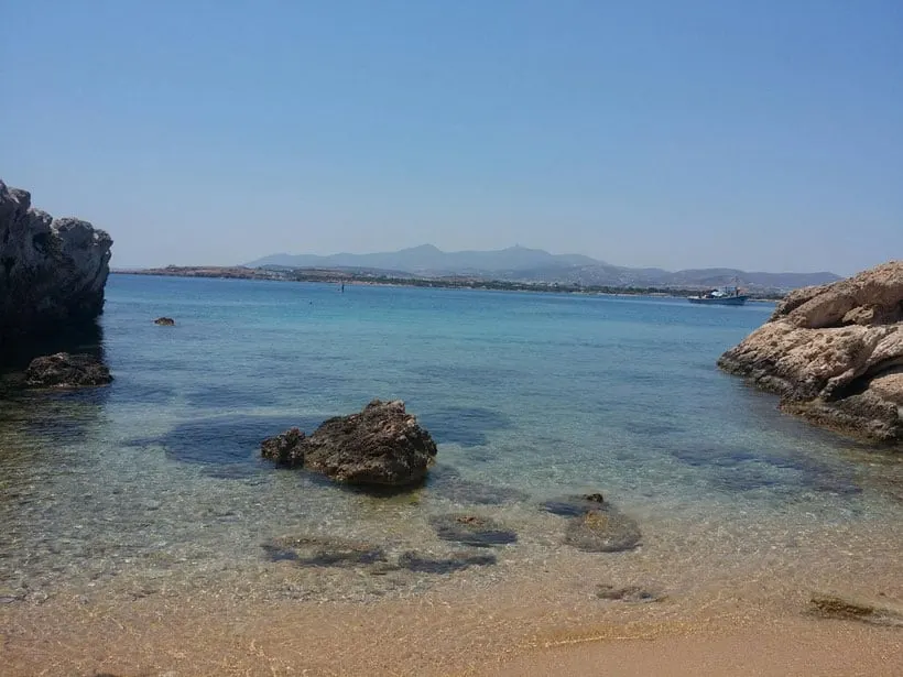 best things to do in paros, rocks in the clear blue waters of paros
