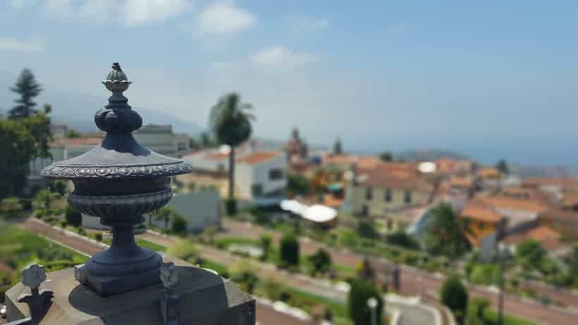 things to do in la orotava, close up of building ornament with blurry town in background