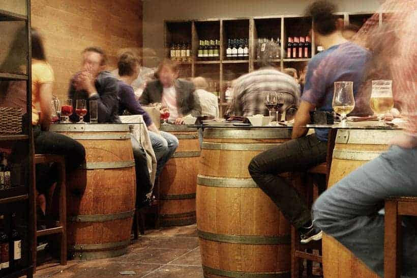 Best Places To Stay in City Center of Madrid, people wine tasting using wine barrels as tables