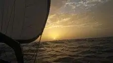 at sea dusk - FAQ Boat HitchHiking