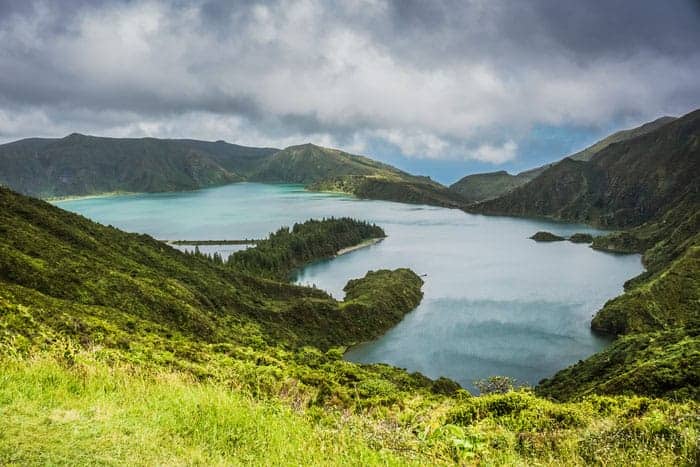 sete cidades, best azores hiking trails, trekking portugal, overlooking a water by surrounded by mountains
