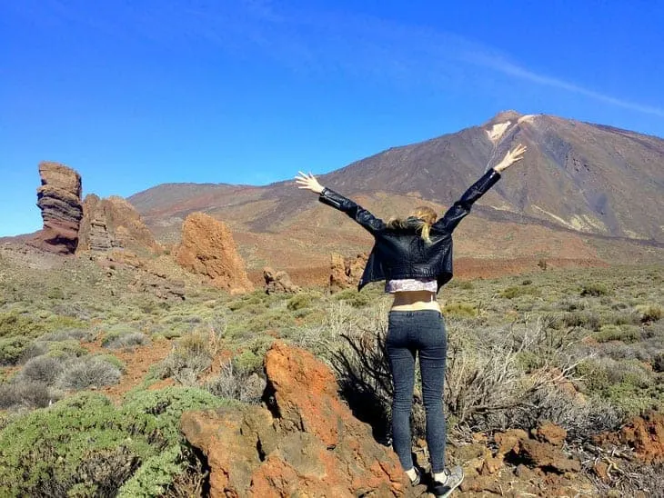 travel blogger girl in front of mount teide, tenerife island, Where To Stay In Tenerife For Hiking