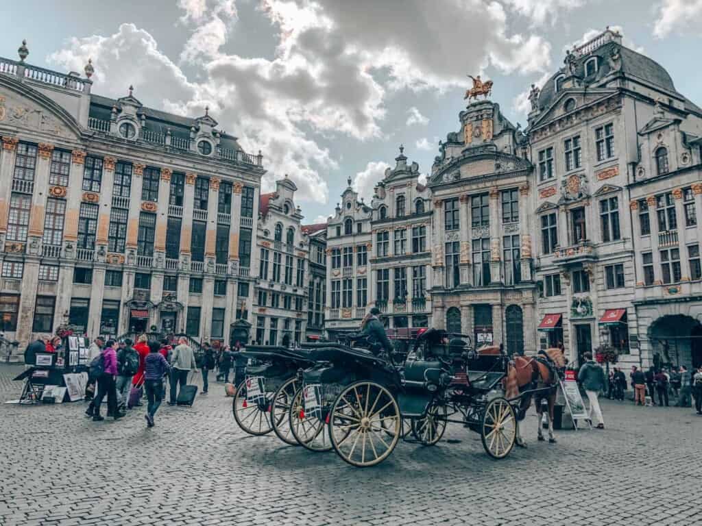 horse carriages on main square in brussels, belgium