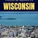 An aerial view of Wisconsin's city with high rise building near the bodies of water. It is a bright day.