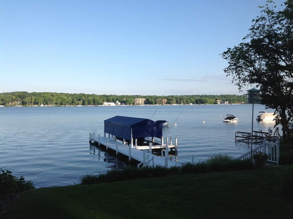 best vacation lakes in wisconsin, boat launch and boats on lake geneva