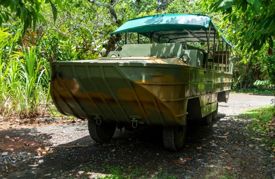 unique things to do in wisconsin Dells, amphibious DUCK boat from WWII in the jungle painted in camo