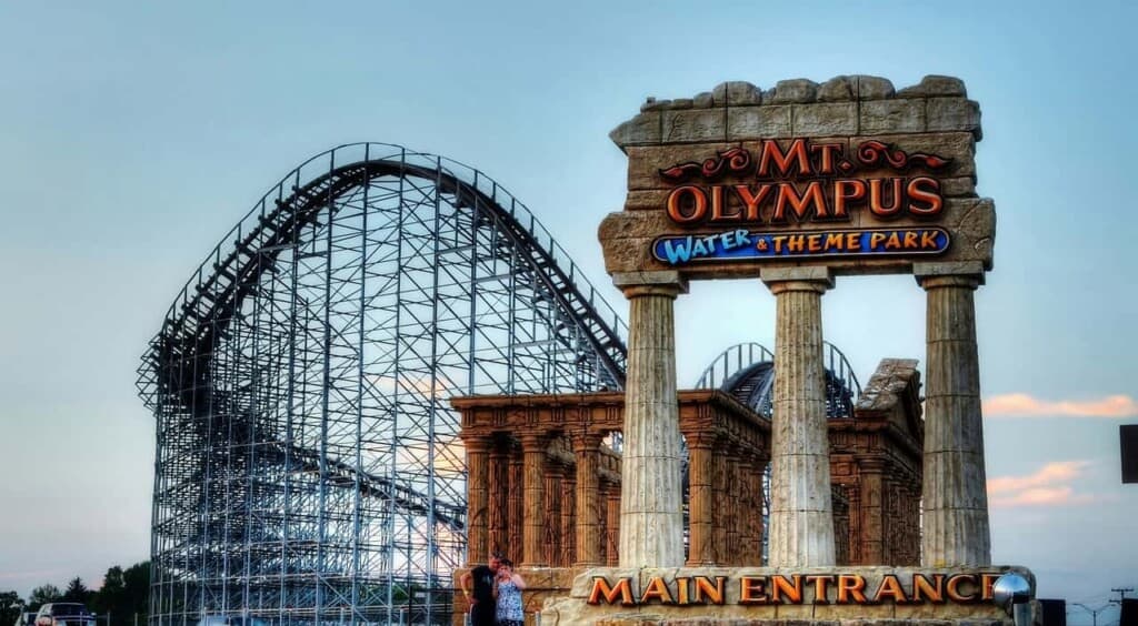 best winter activities in Wisconsin Dells, entrance to Mt Olympus water and theme pack with roller coaster in background