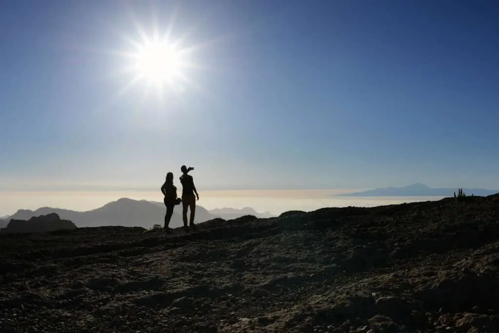 how to get to Teide, couple on top of mountain taking a photo of the view