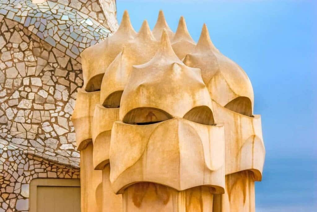 Most famous buildings in barcelona, turrets on Casa Mila (La Pedrera) that look like masked faces
