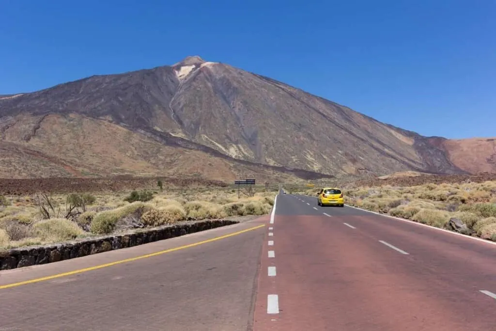 How to visit Mount Teide, road leading towards Mount Teide with yellow car on it