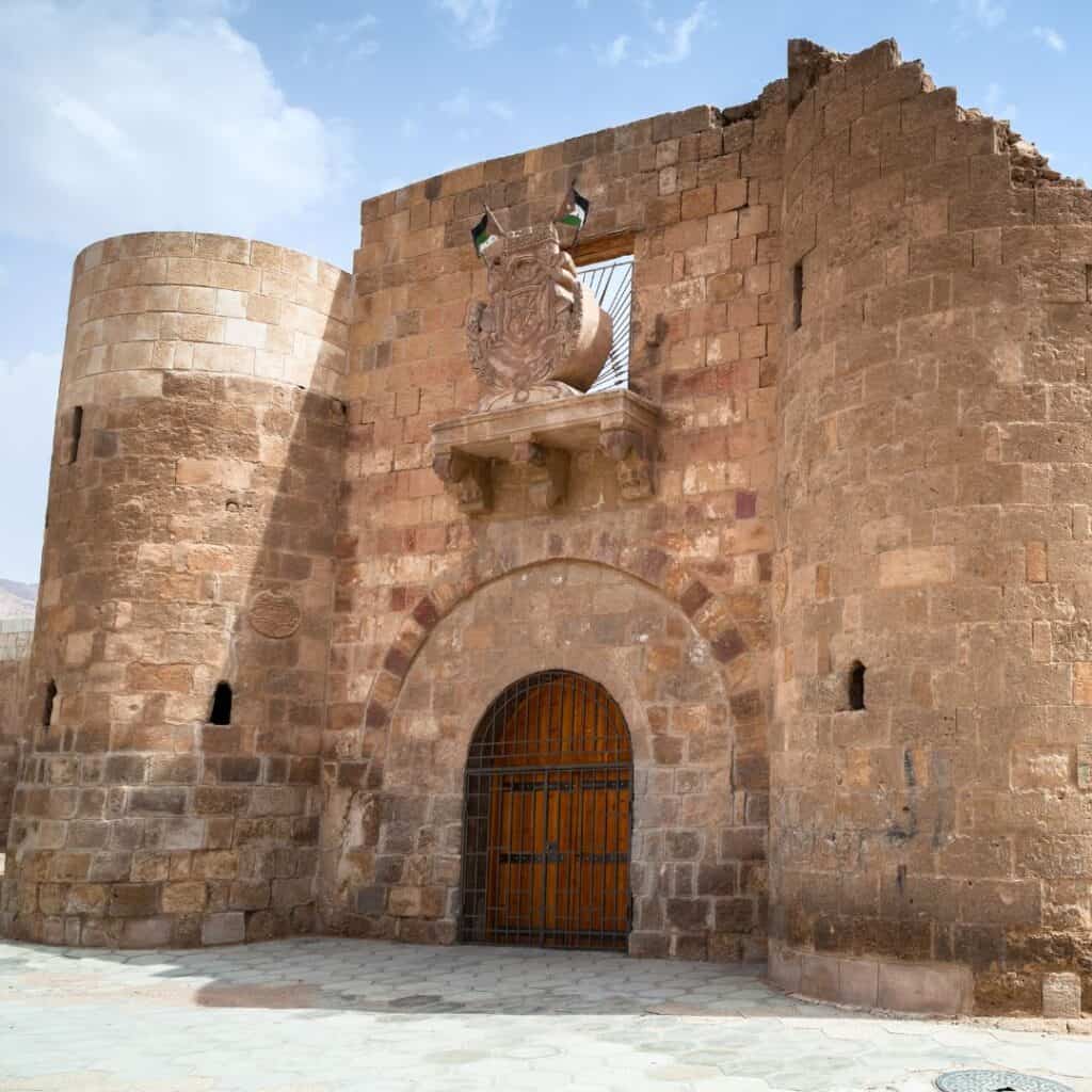 an old fort with a door and a tower
