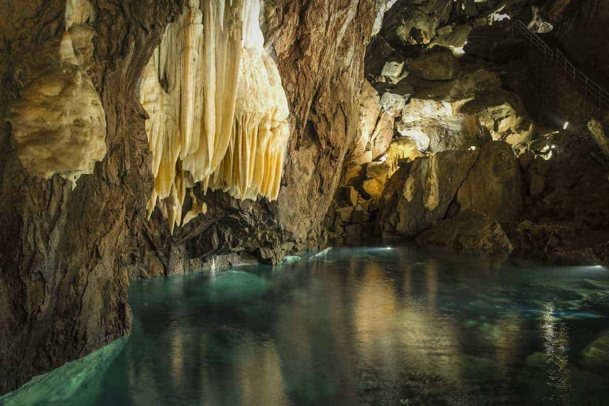 Cave of Wonders in Arcena featuring stalactites and an underground river