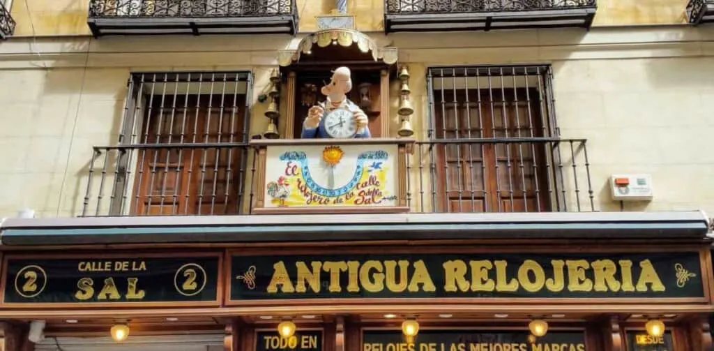 a terrace of an antique shop with a statue on the middle, 24 hours in madrid, one day in madrid, spain, one day itinerary madrid, what to do in madrid for one day, 1 day in madrid, museums, shopping, food, hotels, flamenco