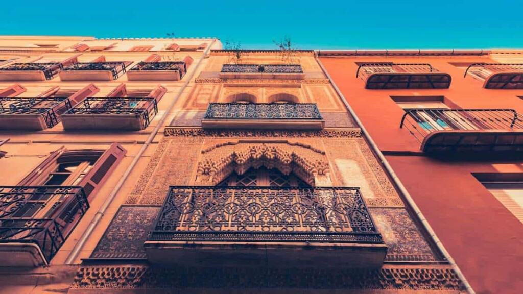 best tours in malaga spain, intricate carvings on side of building in malaga