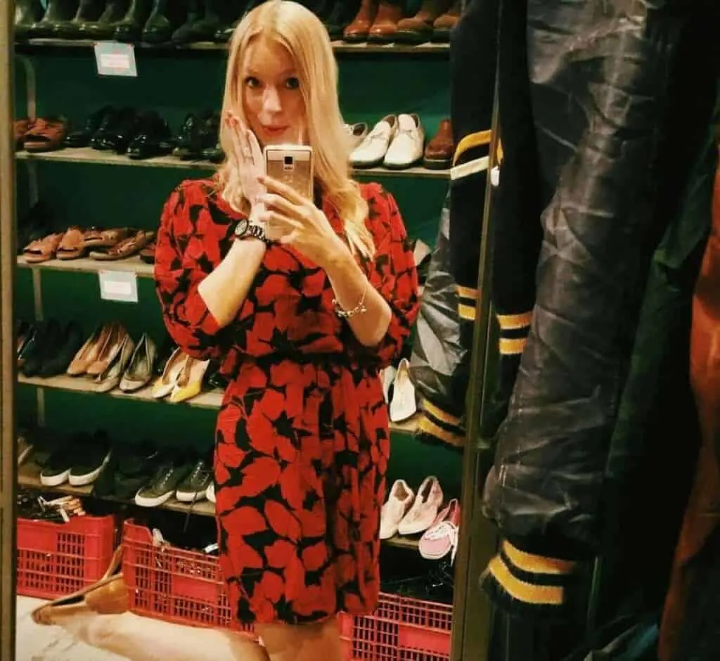 a woman in a red dress on a shoe shop taking a picture from the mirror, 24 hours in madrid, one day in madrid, spain, one day itinerary madrid, what to do in madrid for one day, 1 day in madrid, museums, shopping, food, hotels, flamenco