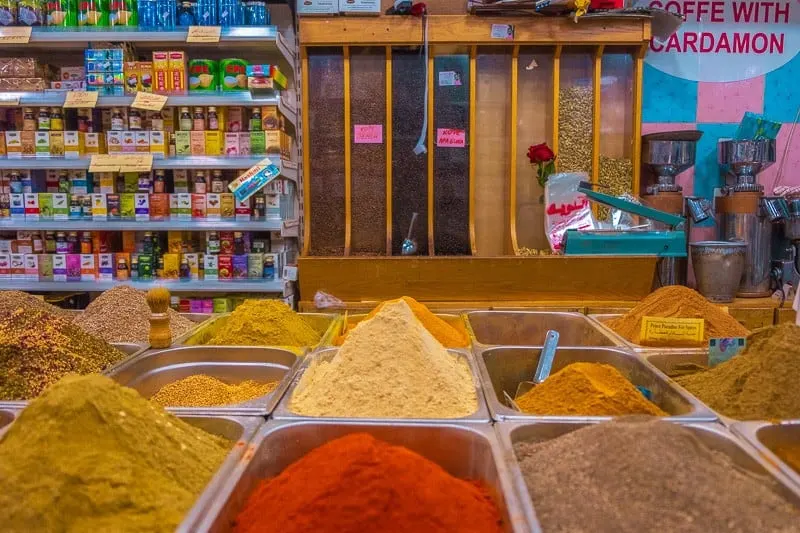 a display of spices and herbs in a souk, things to do in aqaba, jordan, red sea, wadi rum day trip, petra day tour, resorts, ayla oasis, souk, shopping, egypt, beaches, luxury, snorkeling, diving, spices