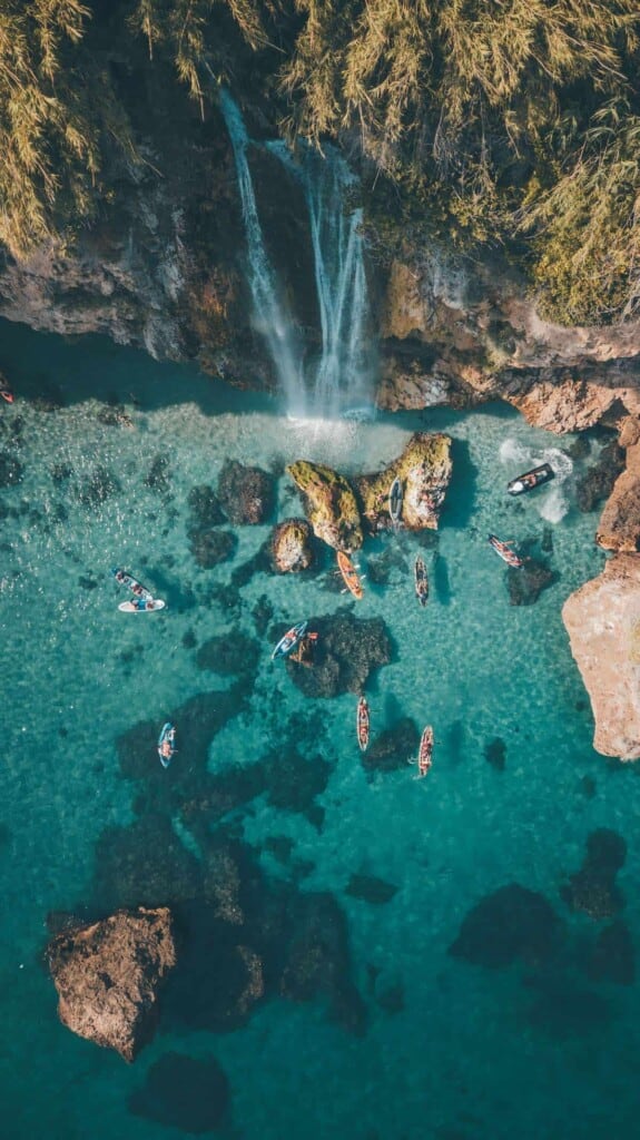 an aerial view of a rocky beach that can be found in one of the best coastal coffee table books. 