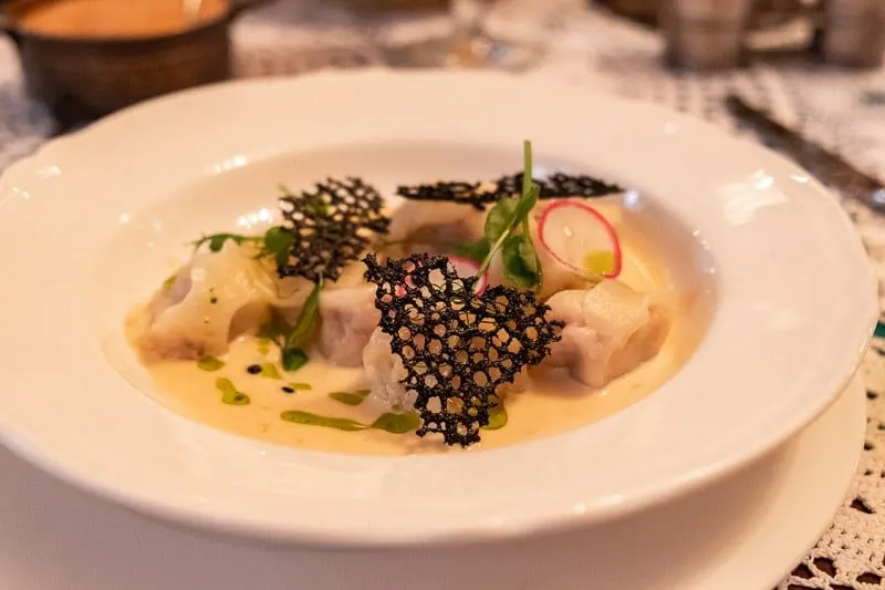 traditional polish meals, plate of dumplings with cream sauce