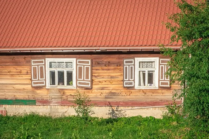 a house with painted open shutters in podlasie, poland