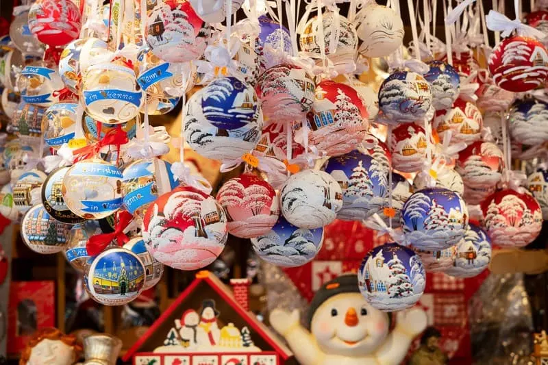 Christmas market kiosk in Belgium, traditional hanging Christmas tree decorations