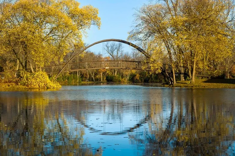 things to do in Wisconsin during fall, Tenney Park bridge on a fall morning, best time fall colors wisconsin