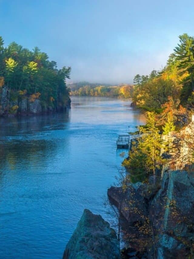 clearing morning fog on the st. croix river in interstate state park, minnesota, autumn.