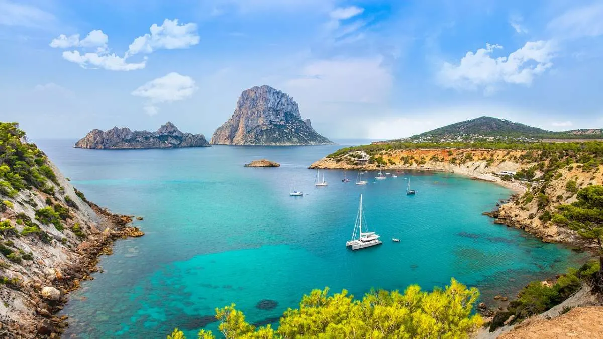 best warm winter holidays in spain, ships sailing in the ibiza coast