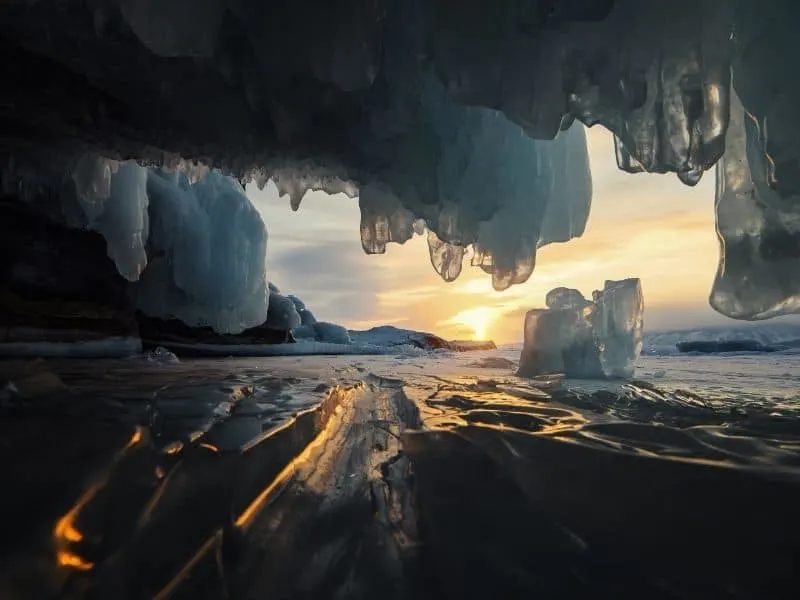 Why visit the Apostle Islands in the winter, view from within a wisconsin ice cave of frozen lake and ice crystals