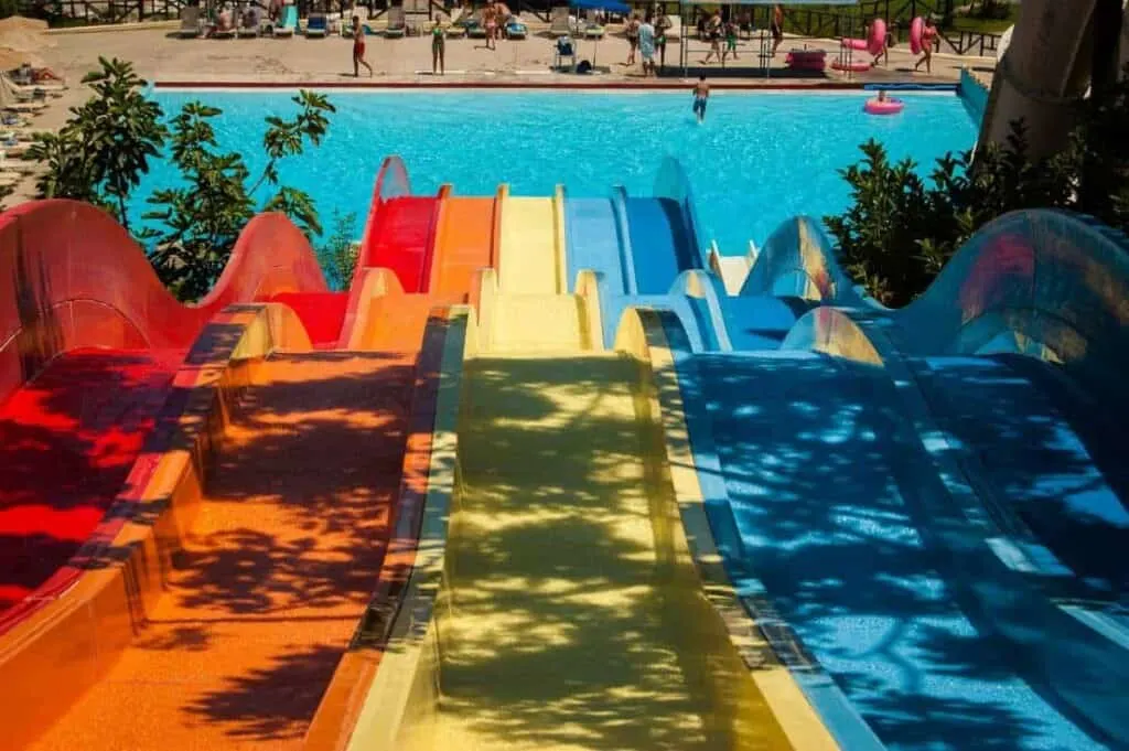 fun vacation spots in wisconsin for couples, colorful water slides leading into pool