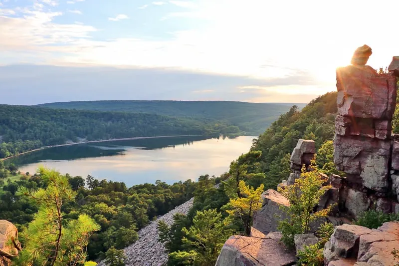 Aerial view on the South shore beach and lake from rocky ice age hiking trail during sunset, Lake State Park, Baraboo area, Wisconsin, Midwest USA.