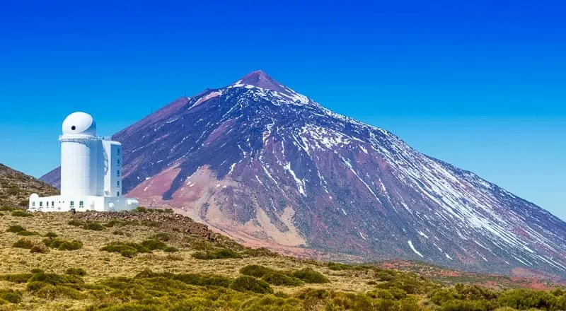 Telescopes of the Izana astronomical observatory on Teide park and Teide Volcano in winter season, Tenerife, Canary Islands, Spain