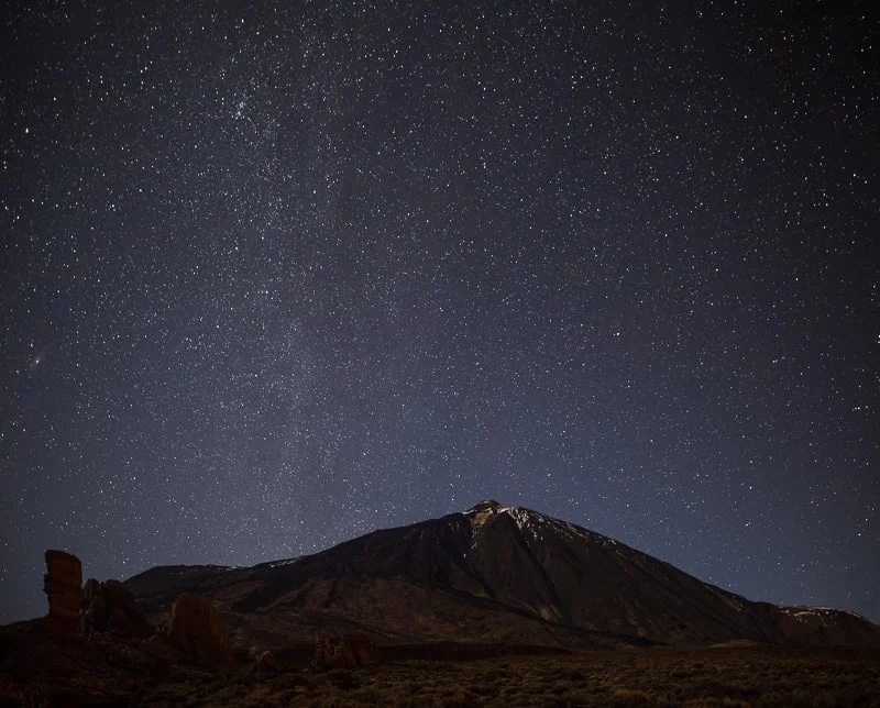 Night sky with shiny stars above volcano El Teide. Milky Way. Night in the Teide National Park, Tenerife, Canary Islands, Spain. Space background